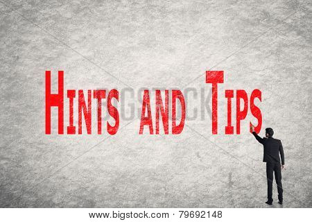 Asian business man write words on wall, Hints and Tips