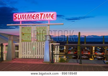 Sea Sunset With Entrance To A Beach Party Tent Along The Dutch Coast
