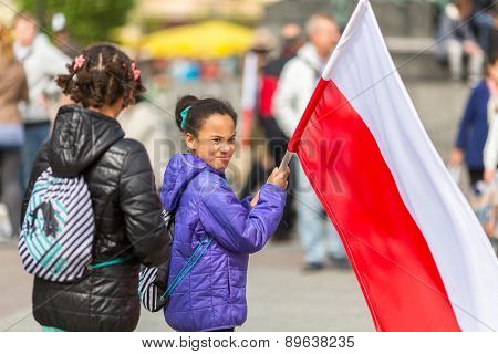 KRAKOW, POLAND - MAY 2, 2015: During Flag Day of the Republic of Polish - is national festival introduced by the Act of 20 Feb 2004. On the same day is celebrated Day of Polonia and Poles Abroad.
