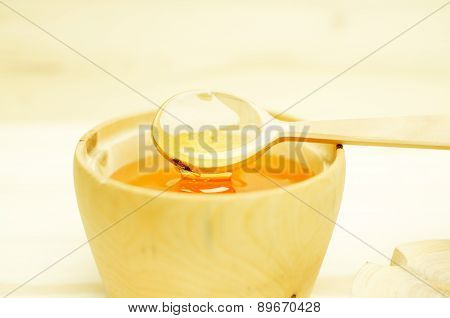 Honey In A Wooden Bowl