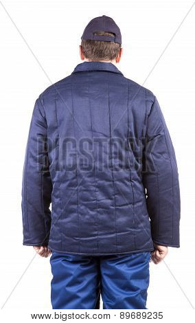 Worker in winter workwear. Back view.