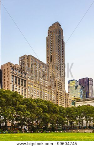 People Enjoy Sunset Light At Bryant Park