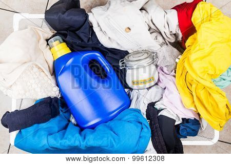 Baking Soda With Detergent And Pile Of Dirty Laundry.