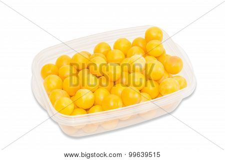 Yellow Cherry Plum In Plastic Tray On A Light Background
