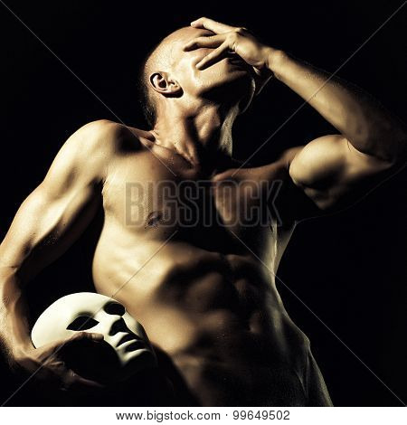 Man Holding Mask
