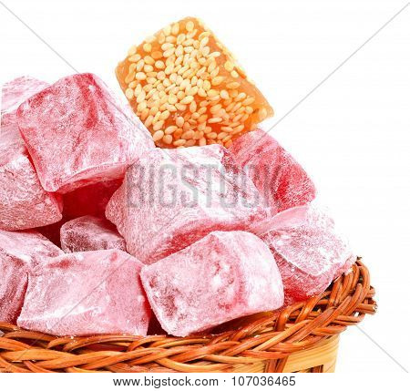 Turkish Sweet Delights In Icing Sugar In The Basket Isolated On White