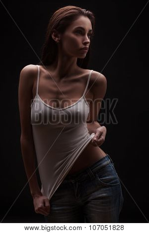 Full portrait of the sexy woman posing in studio