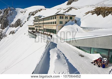 People sunbathe at the terrace of the Pilatus-Kulm luxury hotel at the top of the Pilatus mountain.
