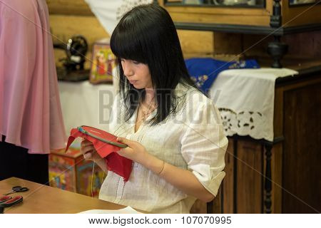Girl Doing Embroidery In The Hoop