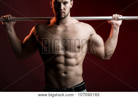 Muscular Man With Crossbar