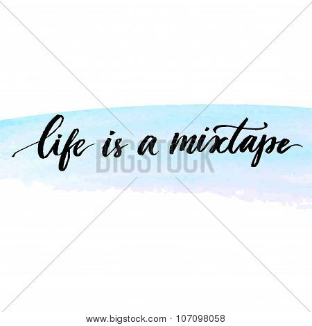 Life is a mixtape. Inspirational quote handwritten with modern calligraphy at delicate blue watercol