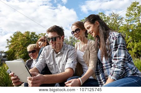 summer, technology, education and teenage concept - group of happy students or teenagers with tablet pc computer taking selfie