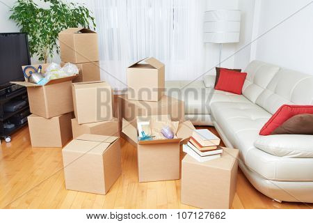 Moving boxes in new house. Real estate concept.