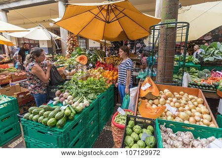 FUNCHAL, MADEIRA, PORTUGAL - JUNE 29, 2015: Bustling fruit and vegetable market in Funchal Madeira on June 29, 2015.