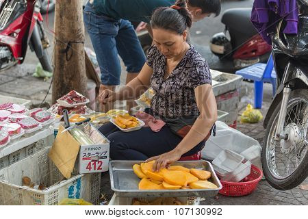 VIETNAM - JUNE 10, 2015: An unidentified woman peels and sells durian fruit. Regarded by locals as the 