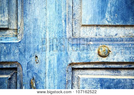 Stripped   In   Blue Wood Door And Rusty Nail