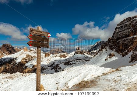 tourist paths directions and travel time shown on a traditional direction signs at the Dolomiti mountains, Italy