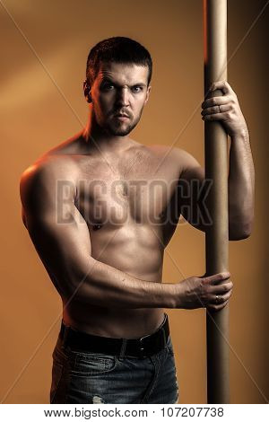 Muscular Man With Crossbar