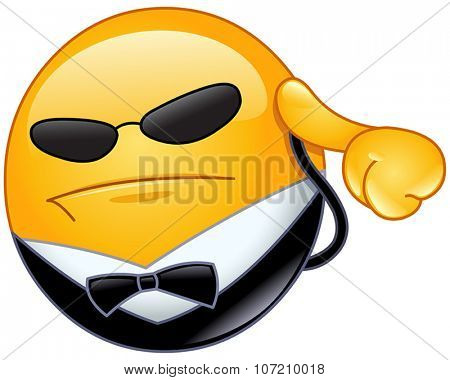 Bodyguard yellow ball listening to his earpiece
