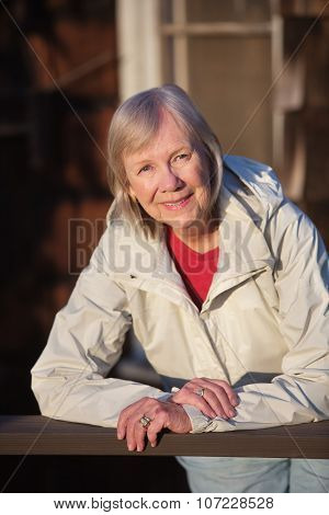 Senior Woman Leaning On Railing