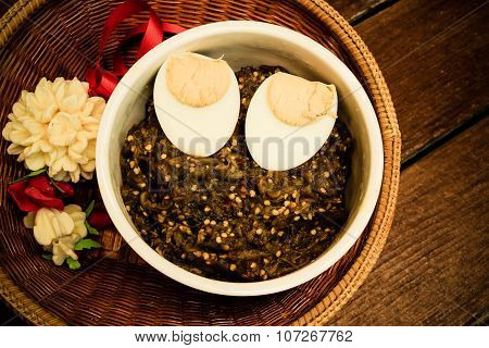 Thai Food Pound Eggplant With Boiled Egg On Wood Table , Vintage Style