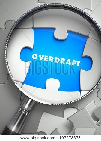 Overdraft - Missing Puzzle Piece through Magnifier.