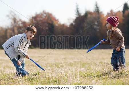 Kids Playing Tennis Outside