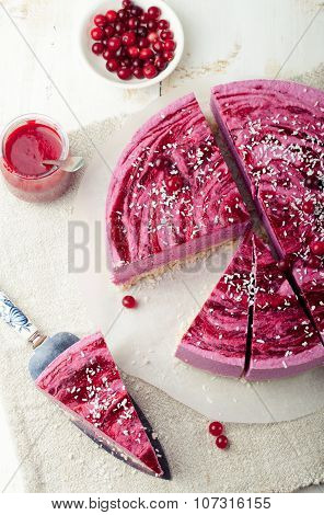 Raw vegan berry cheesecake gluten free. Wooden background