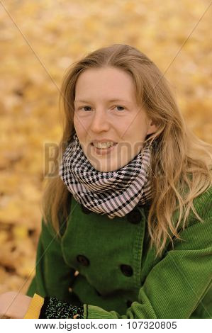 Girl In Autumn Leaves