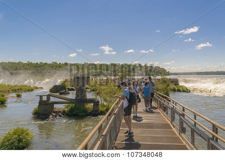 Tourists At Birdge In Parana River At Iguazu Falls