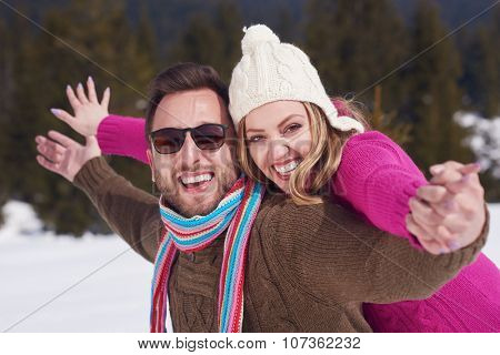portrait of happy young romantic tourist  couple outdoor in nature at winter vacation