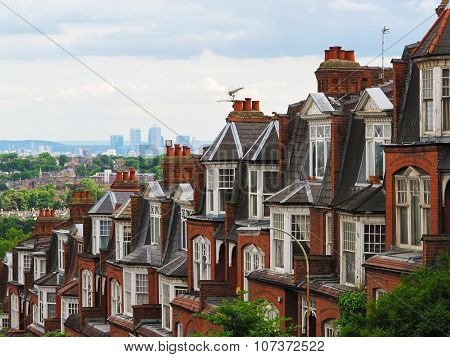 Brick houses of Muswell Hill and panorama of London with Canary Wharf, London, UK