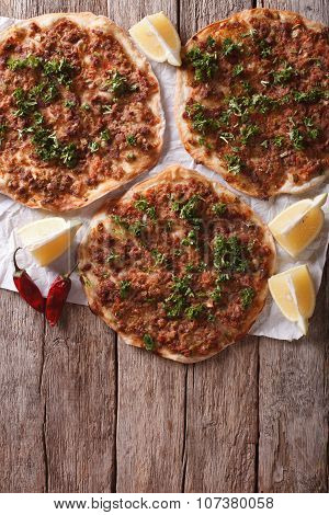 Asian Pizza Lahmacun On A Table. Vertical Top View