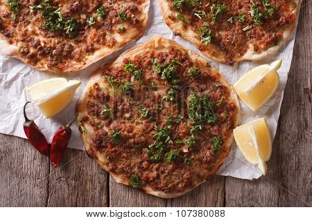 Asian Pizza Lahmacun Closeup On A Wooden Table. Horizontal Top View