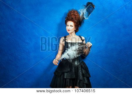 Girl With Lush Hair High In A Corset And Skirt.