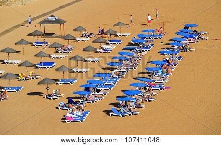 People enjoying the sun on Albufeira Beach