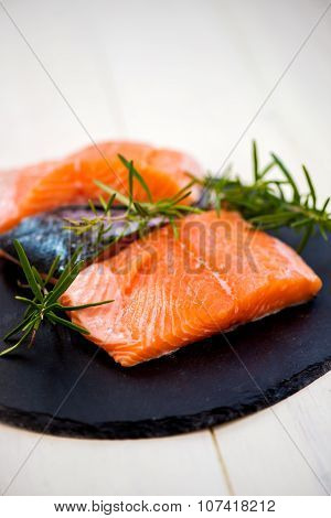 Portions Of Fresh Salmon Fillets With Aromatic Herbs And Spices