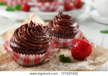 Chocolate cupcakes on craftpaper closeup