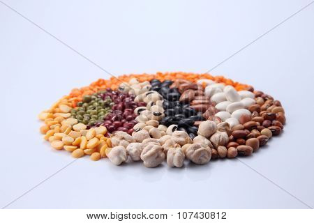 assorted beans arranged in a round shape