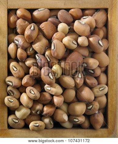 top view of Nigerian brown beans in a wooden container