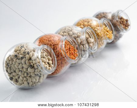 assorted beans arranged in a row