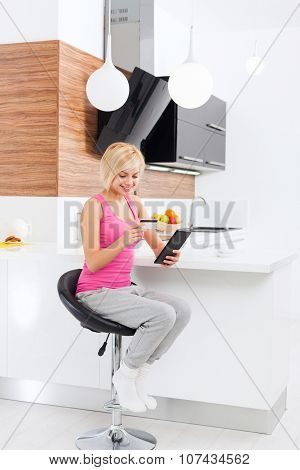 beautiful woman smile holding credit card with tablet touch screen