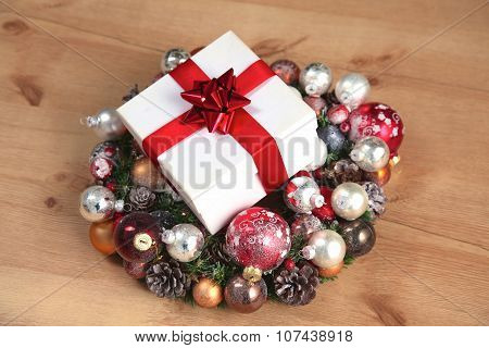 New Year gift on a golden tinsel background boly