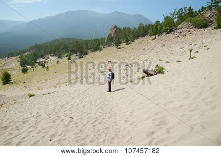 Sibaria,RU-July,27 2015:Lone Traveler In The Middle Of The Sand In Sunny Day. Sandy Bay, Lake Baikal