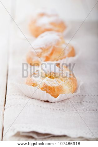 Profiteroles, choux with a custard cream. Dessert