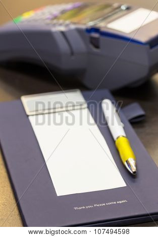 The Word Thank You On Credit Card Receipt Writing Pad With Blank Paper And Credit Card Machine In Ba
