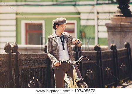 Young Woman At Vintage Bicycle British Style