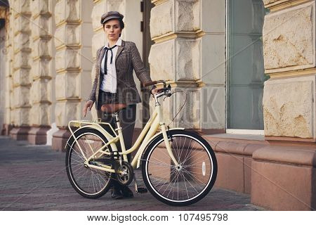 Young Woman At Vintage Bicycle British Style