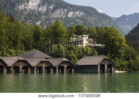 KOENIGSSEE, GERMANY - AUGUST 13, 2015: Boathouses at the Koenigssee lake for pleasure boats which commute between Schoenau St. Bartholomew and Salet