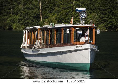 KOENIGSSEE, GERMANY - AUGUST 13, 2015: Electric pleasure boat operating on the Koenigssee lake and commute between Schoenau St. Bartholomew and Salet